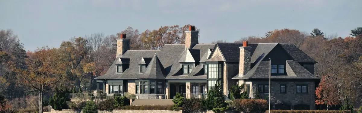 Large stone house on the water's edge