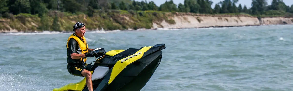 man riding personal watercraft