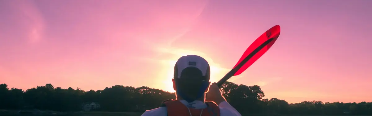 man riding on kayak