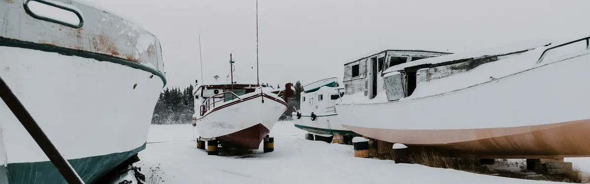 three boats on snow ground